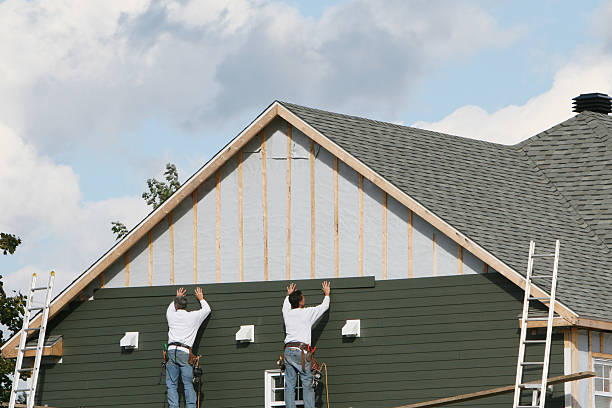 Professional Siding Installation technician working in Oak Hill, FL